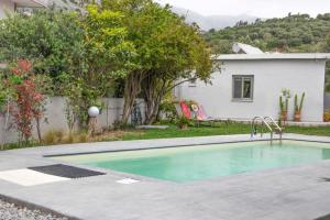 a swimming pool in the backyard of a house at Plakias Riviera in Plakias