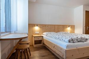 Postel nebo postele na pokoji v ubytování Thusnelda Apartment A