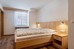 Postel nebo postele na pokoji v ubytování Thusnelda Apartment A