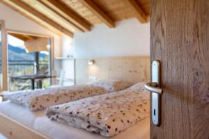 Postel nebo postele na pokoji v ubytování Thusnelda Apartment A