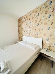 Postel nebo postele na pokoji v ubytování Il Giramondo Suite&Room self check-in