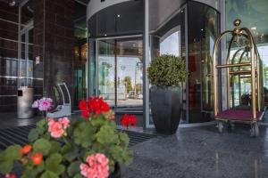 a store front with flowers in front of a building at Ramada by Wyndham Kazan City Centre in Kazan