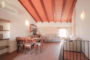 a living room with a table and chairs and a couch at Casa Ijana in Novigrad Istria +21 photos