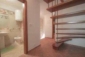 a bathroom with a sink and a toilet in a room at Casa Ijana in Novigrad Istria