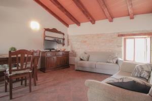 a living room with a couch and a table at Casa Ijana in Novigrad Istria