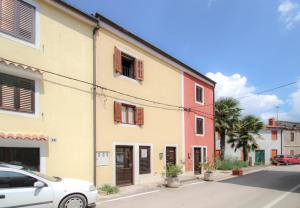 a white car parked in front of a building at Casa Ijana in Novigrad Istria