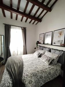 a bedroom with a bed and a window at Casa in Centro Storico vista Gran Sasso in Atri