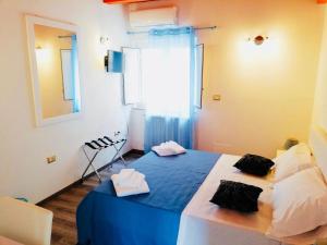 Postel nebo postele na pokoji v ubytování Residence Nina