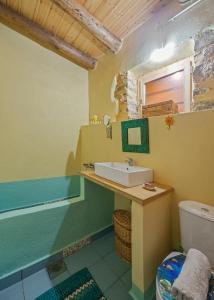 a bathroom with a sink and a toilet at Hani Kastania - Chania retreat for families and groups for holidays and workshops in Sémbronas +37 photos