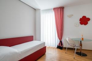 Krevet ili kreveti u jedinici u objektu Santo Stefano Design Apartment by Wonderful Italy