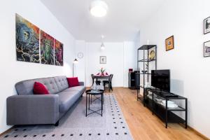 Televízia a/alebo spoločenská miestnosť v ubytovaní Apartment MERAN