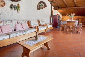 a living room with a couch and a table at In Valtellina da Valter e Lella in Colorina