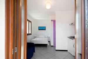 a room with a bedroom with a bed in it at Monolocale Fattorialmare Viola in Camogli
