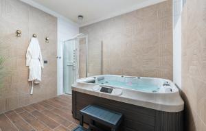 a large bathroom with a tub and a shower at Hotel Dua Residence in Poreč +26 photos
