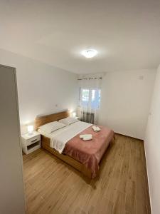 Posteľ alebo postele v izbe v ubytovaní Apartman Maša