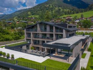 an aerial view of a house with mountains in the background at Apartment Emma Deluxe Aparthotel-5 by Interhome in Fürth