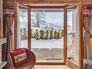a room with a window with a view of snow at Apartment Cérémonia 1 by Interhome in Villars-sur-Ollon