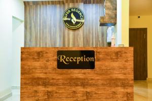 a reception desk with a sign on top of it at SILVER REGENCY in Guwahati