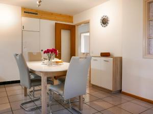 a dining room with a table and chairs at Holiday Home Terry by Interhome in Olivone