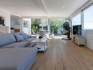 a living room with a couch and a table at Holiday Home Pitágoras by Interhome in Roses