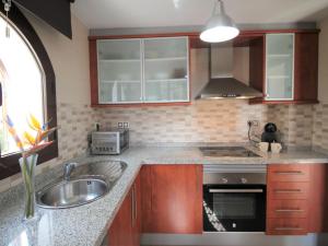 A kitchen or kitchenette at Holiday Home Flor de Ponoig by Interhome