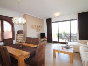 A television and/or entertainment centre at Holiday Home Flor de Ponoig by Interhome