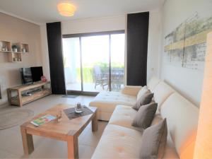 A seating area at Holiday Home Flor de Ponoig by Interhome