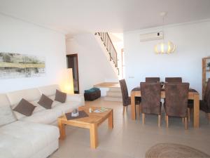 A seating area at Holiday Home Flor de Ponoig by Interhome Még 24 kép