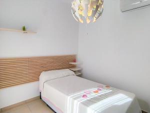 A bed or beds in a room at Holiday Home Flor de Ponoig by Interhome