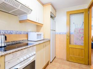 Kuchyň nebo kuchyňský kout v ubytování Apartment Entreplayas - Morro de Gos by Interhome