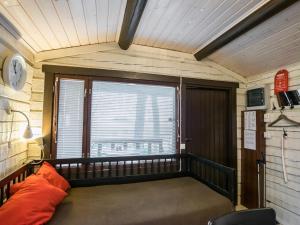 a room with a bed in a room with a window at Holiday Home Anttoora a-sauna by Interhome in Pori