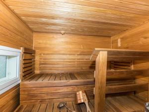 a wooden sauna in a cabin with wood paneling at Holiday Home A-sauna by Interhome in Pori