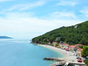 a view of a beach with houses and the water at Apartment Pinka by Interhome in Mošćenička Draga