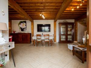 a kitchen and dining room with a table and chairs at Holiday Home Mulini by Interhome in Pugnano