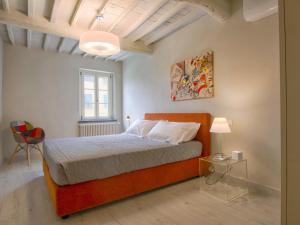 En eller flere senger på et rom på Holiday Home Glicine by Interhome