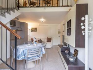 a living room with a table and a couch at Apartment Vista Mare by Interhome in Latte
