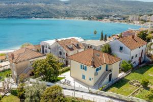 an aerial view of a house and the water at Magnolia Apartments 1 Herceg Novi in Herceg-Novi