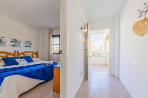 A bed or beds in a room at Apartamentos Riviera Arysal