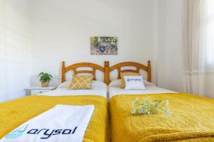 A bed or beds in a room at Apartamentos Riviera Arysal