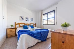 A bed or beds in a room at Apartamentos Riviera Arysal