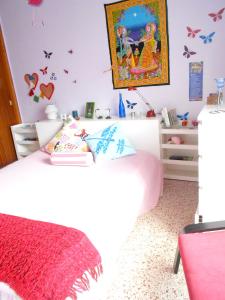 A bed or beds in a room at Cozy House in Candelaria, Sea View