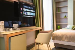 Postel nebo postele na pokoji v ubytování Carine Hotel Centar