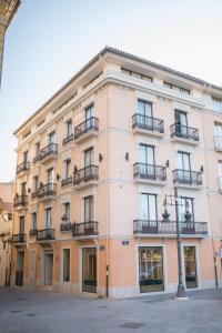 a large building with balconies on the side of it at MYR Puerta Serranos in Valencia