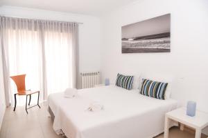 Posteľ alebo postele v izbe v ubytovaní Casa Moana