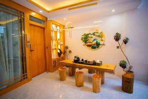 Galerija fotografija objekta 诗画吉意设计师花园民宿 u gradu 'Lijiang'