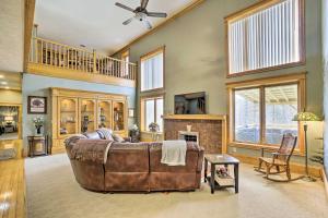 a large living room with a couch and a fireplace at Vast McArthur Home Near Wayne National Forest in Hamden