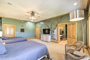 a bedroom with two beds and a ceiling fan at Vast McArthur Home Near Wayne National Forest in Hamden