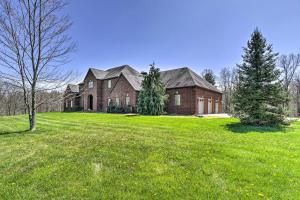 a large brick house with a green yard at Vast McArthur Home Near Wayne National Forest in Hamden