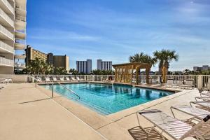 a swimming pool with lounge chairs on a building at The Terrace at Pelican Beach Resort: View + Pool! in Destin