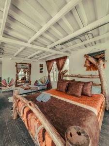 A bed or beds in a room at Pachamama finca hotel - spa